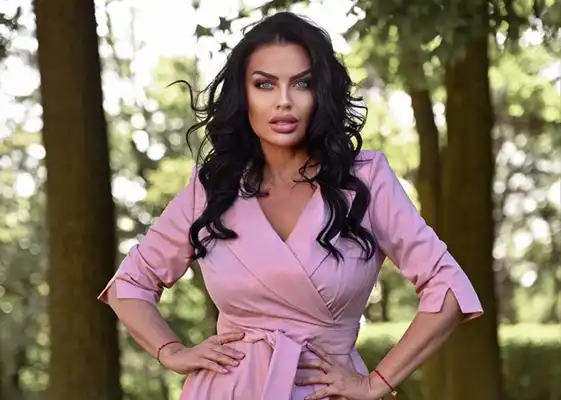 Model in a pink DANA Collection dress outdoors