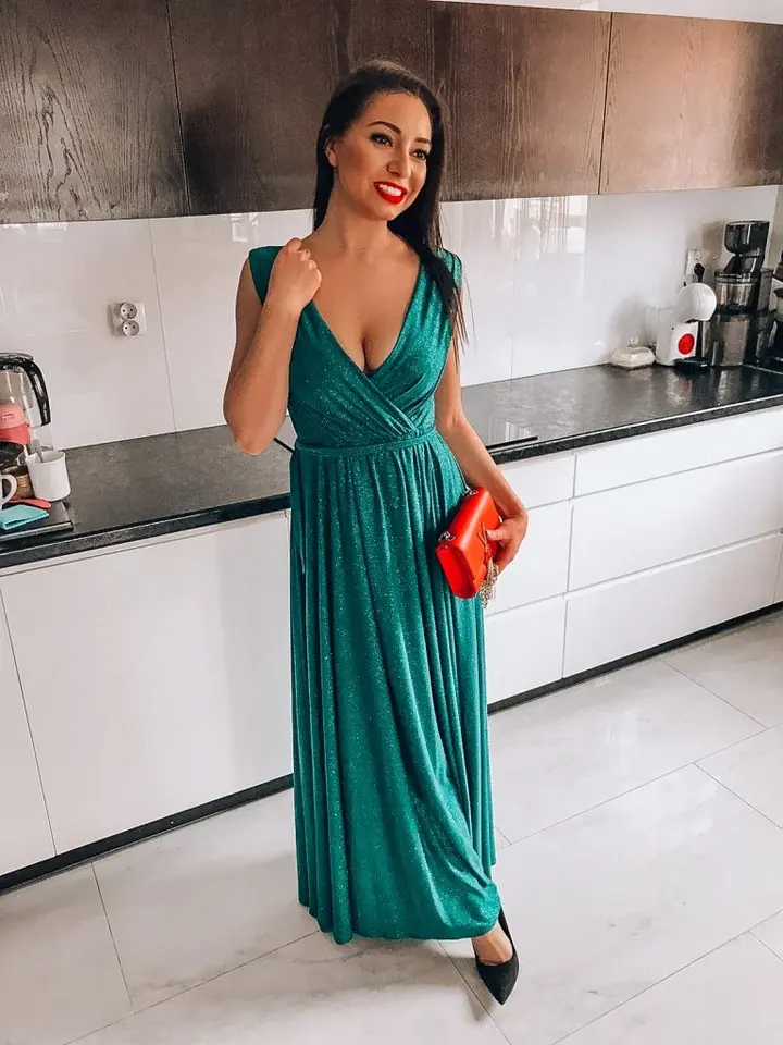 Model in a long green dress DANA Collection